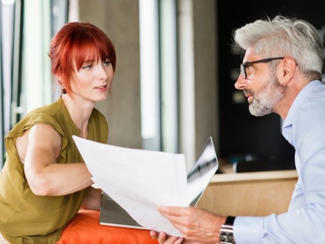 business-people-in-creative-office-consulting-a-P48WVT9